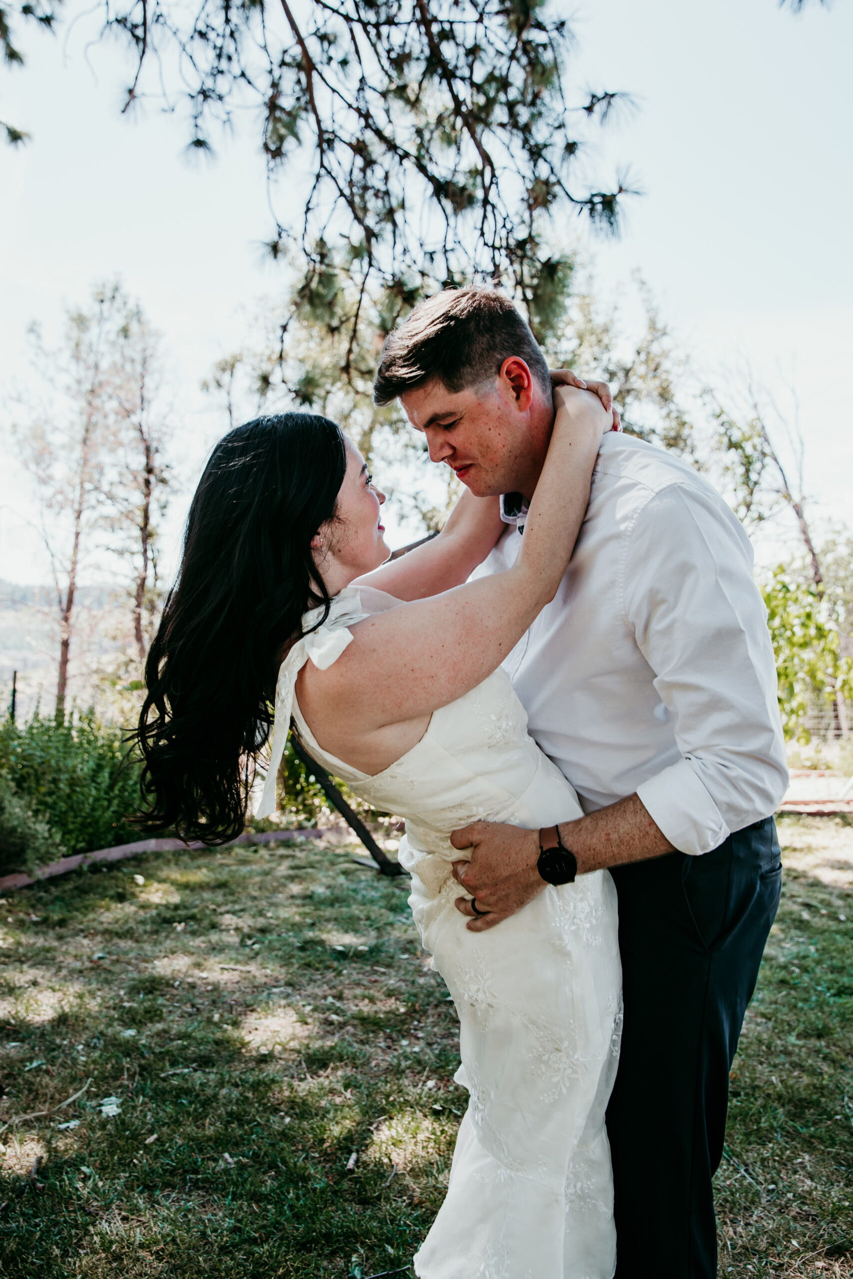 Bride and groom embrace in the backyard of their Airbnb elopement in Northern California, captured by a local elopement photographer.
