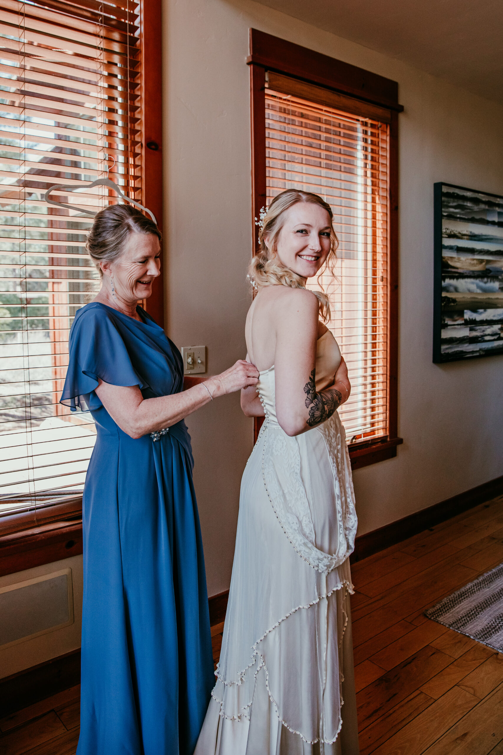 Bride getting ready with her mother inside a cozy cabin before their Lake Tahoe elopement, capturing intimate lake tahoe elopement photos during a quiet pre-ceremony moment