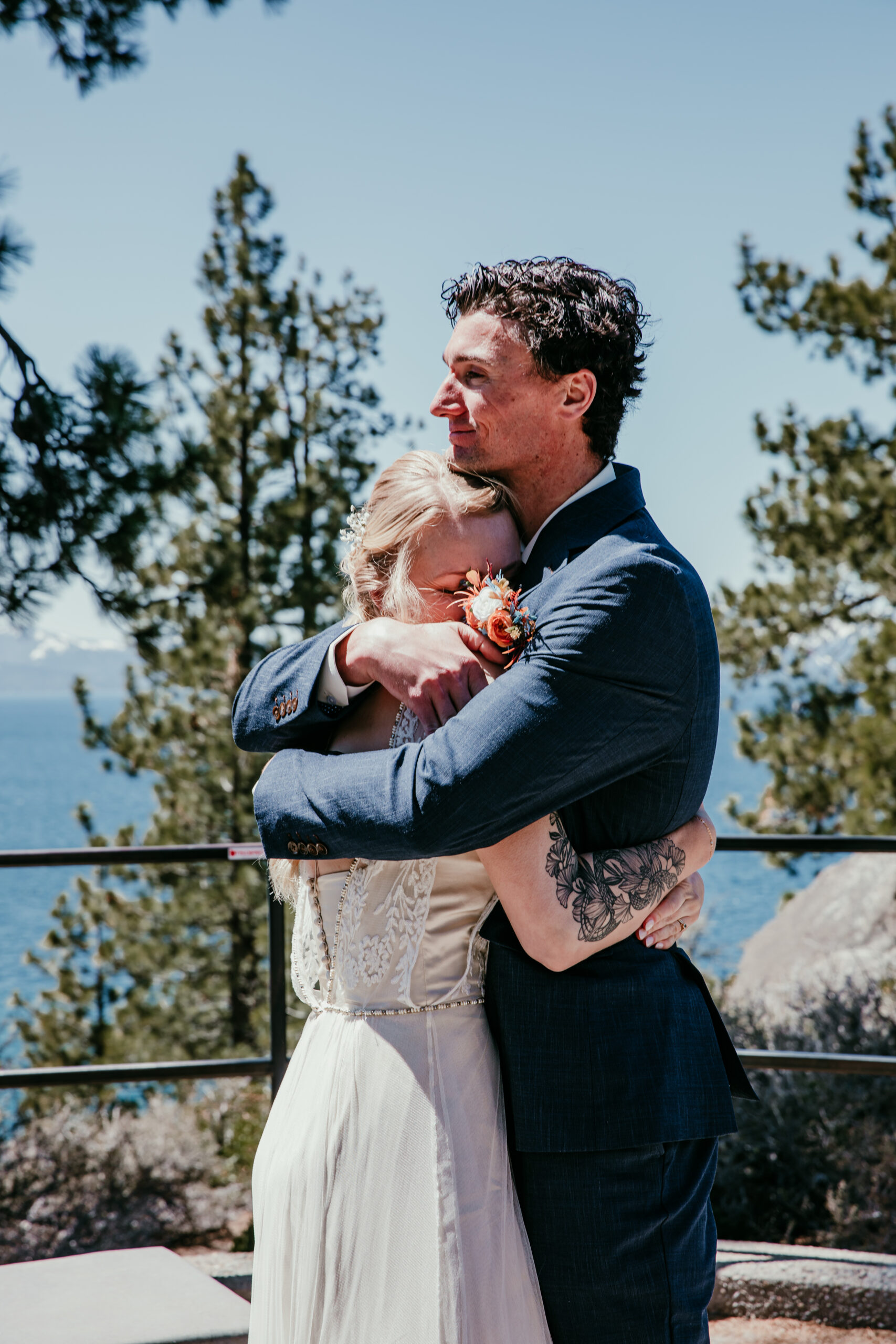 Bride and groom sharing a tearful embrace after their vows at their Logan Shoals Vista Point elopement