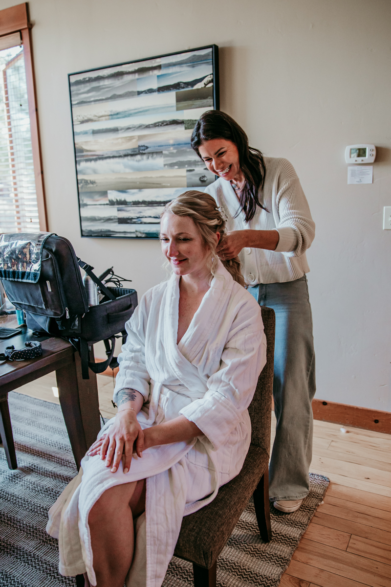 Bride getting her hair styled before her Logan Shoals Vista Point elopement in Lake Tahoe