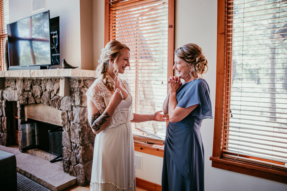 Bride sharing a joyful moment with her mom before the ceremony
