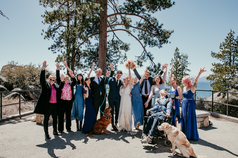 Wedding guests cheering with the newlyweds and their dogs after the Logan Shoals Vista Point elopement ceremony