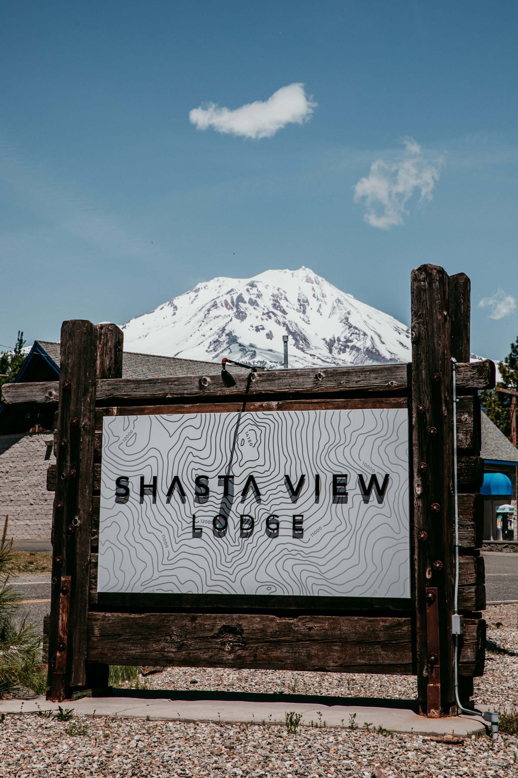 Shasta View Lodge sign with Mount Shasta in the background, a scenic venue option for couples eloping in Mount Shasta.