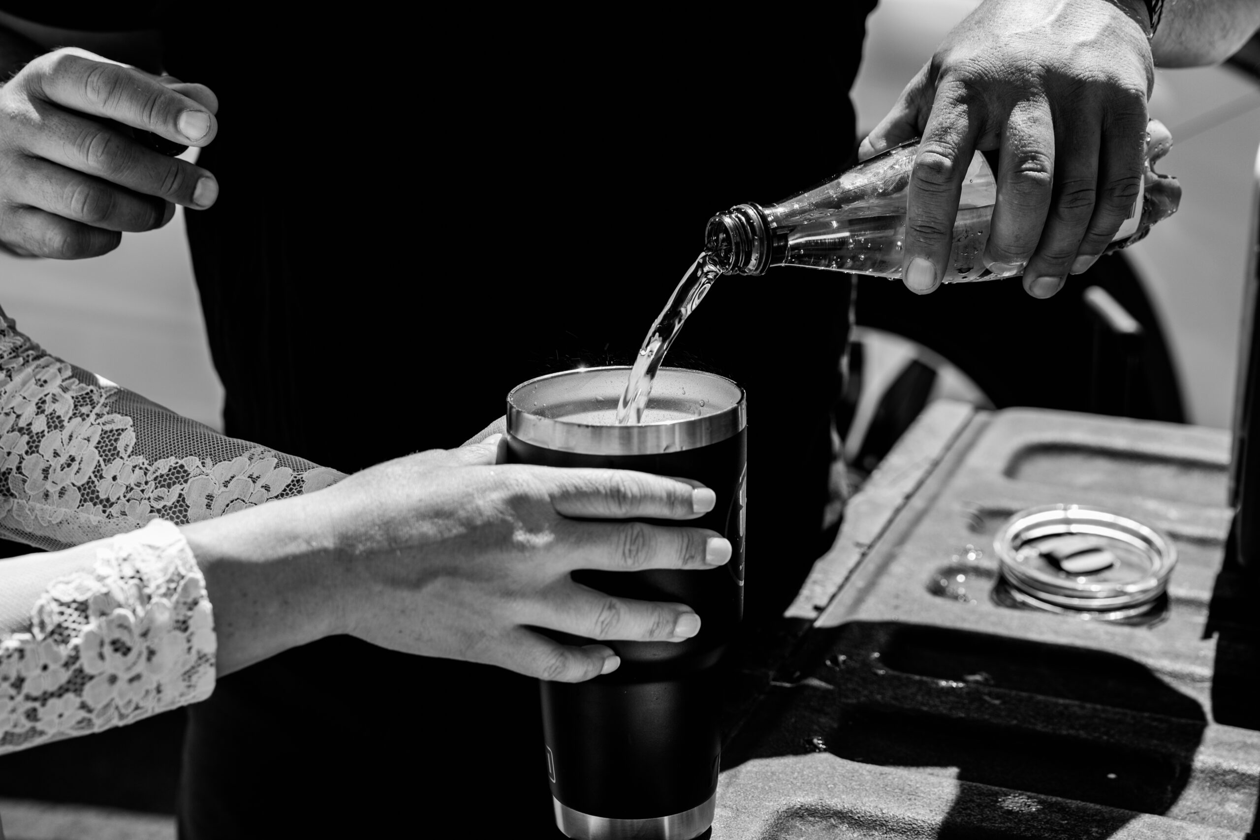 Close-up of drinks being poured during a tailgate break at an elopement in Lake Tahoe.