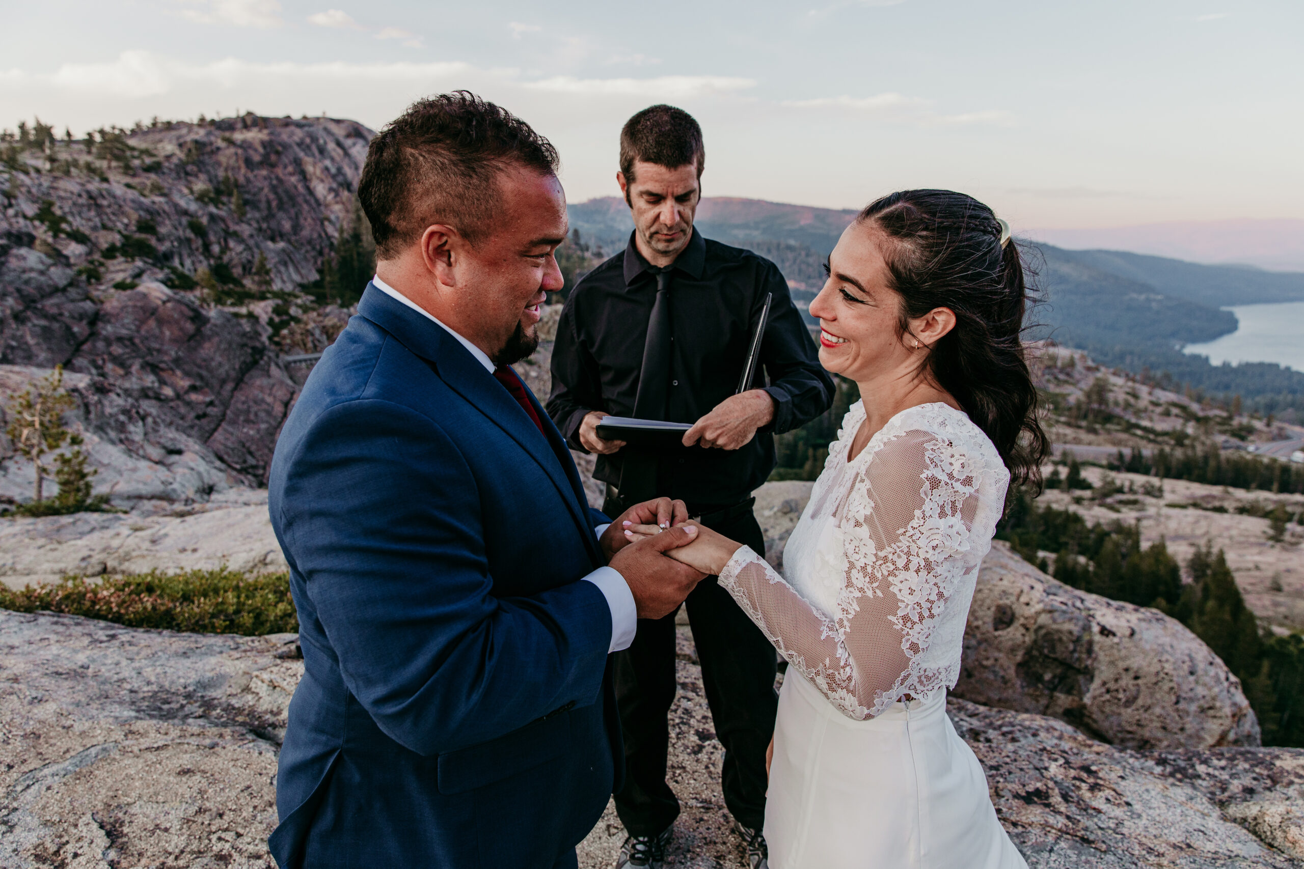 Elopement in Lake Tahoe with the couple exchanging rings during their mountain-top ceremony.