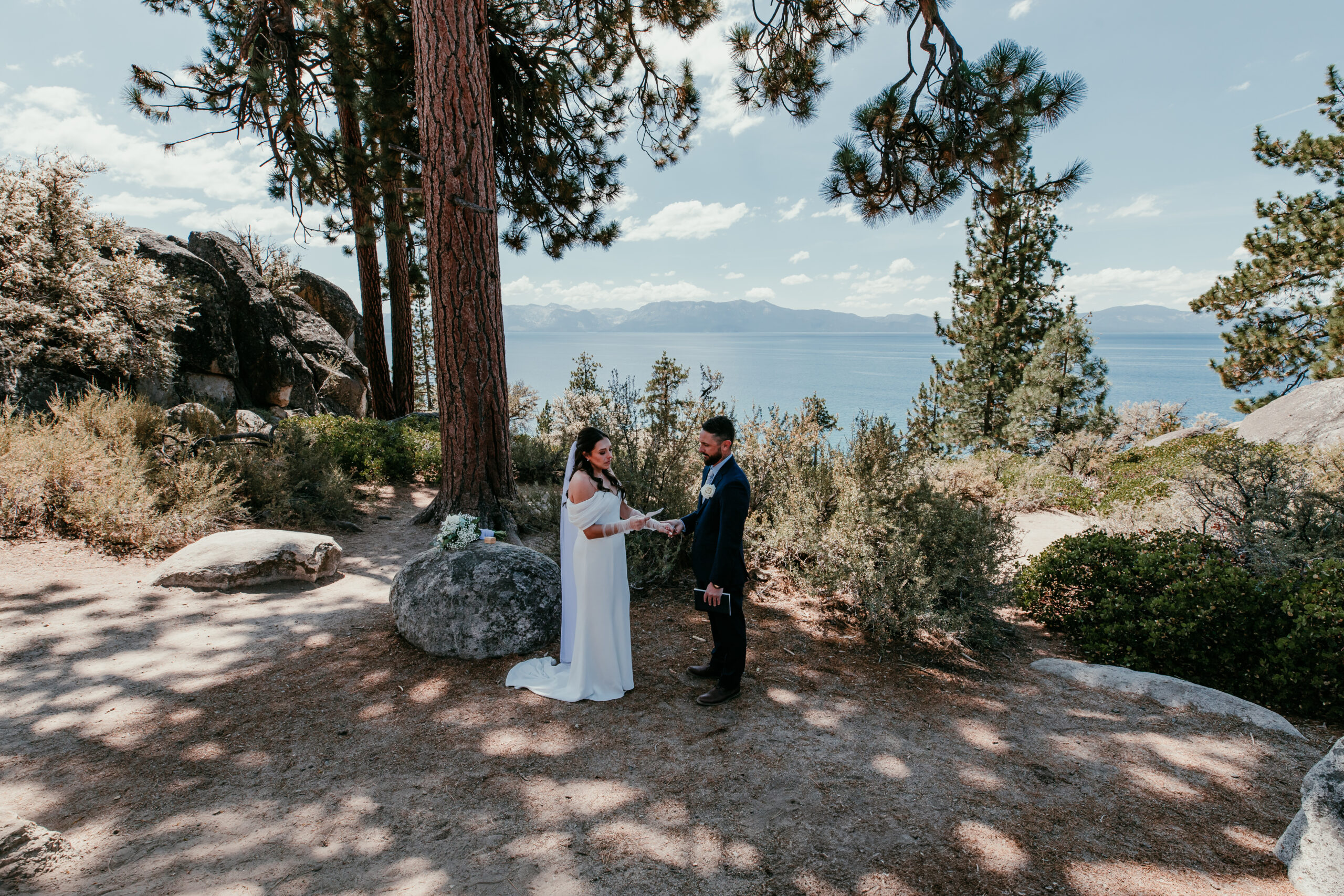  Couple standing at Logan Shoals Vista Point during their summer Lake Tahoe elopement.