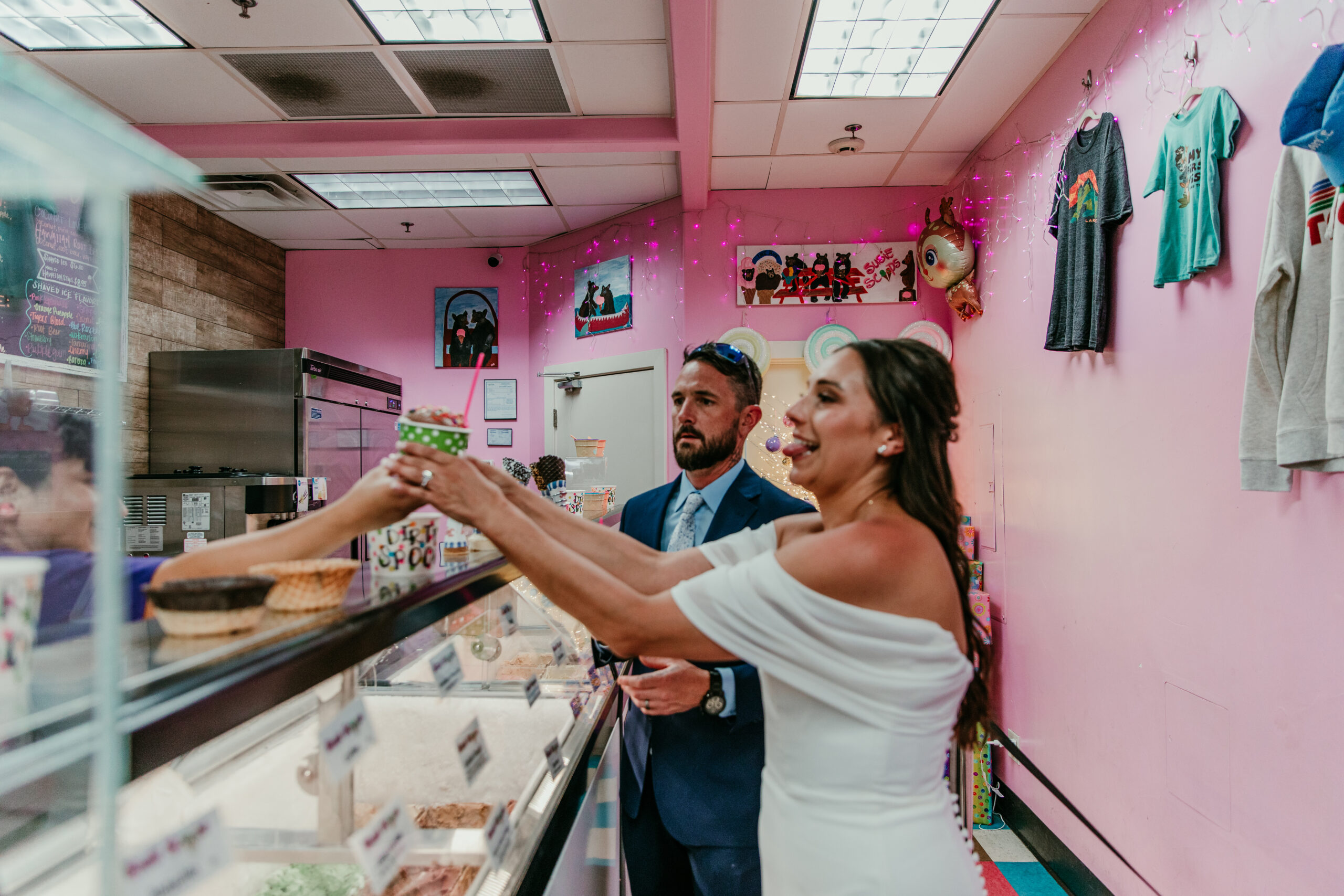 Bride receiving ice cream at Susie Scoops during a fun elopement Lake Tahoe moment.