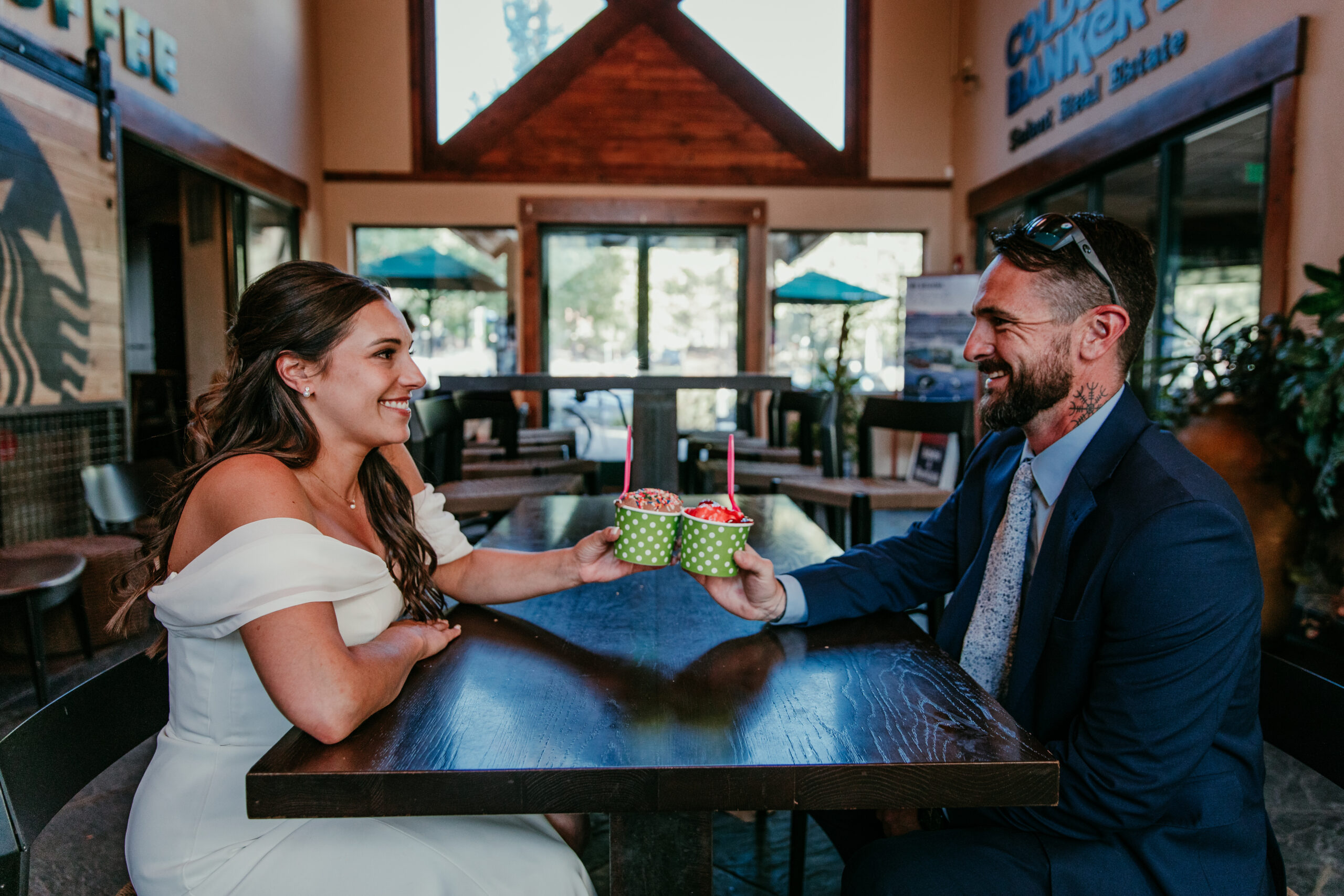 Bride and groom sharing ice cream together at Susie Scoops during their elopement Lake Tahoe.