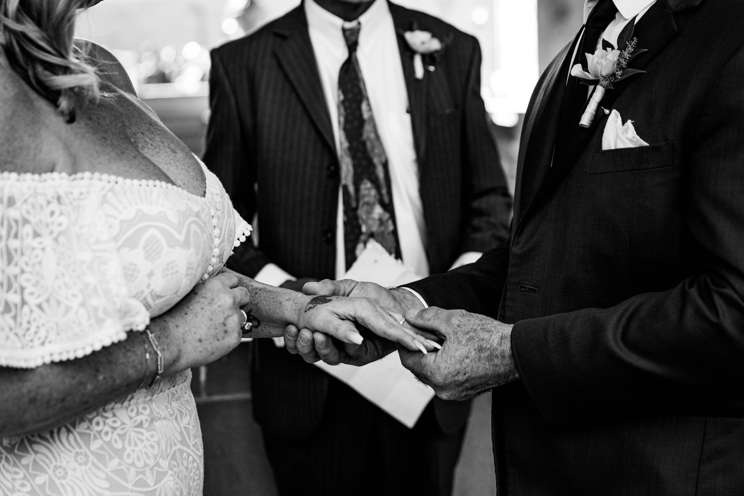 Black and white close-up of the couple exchanging rings during their San Francisco City Hall elopement, captured by a san francisco elopement photographer.