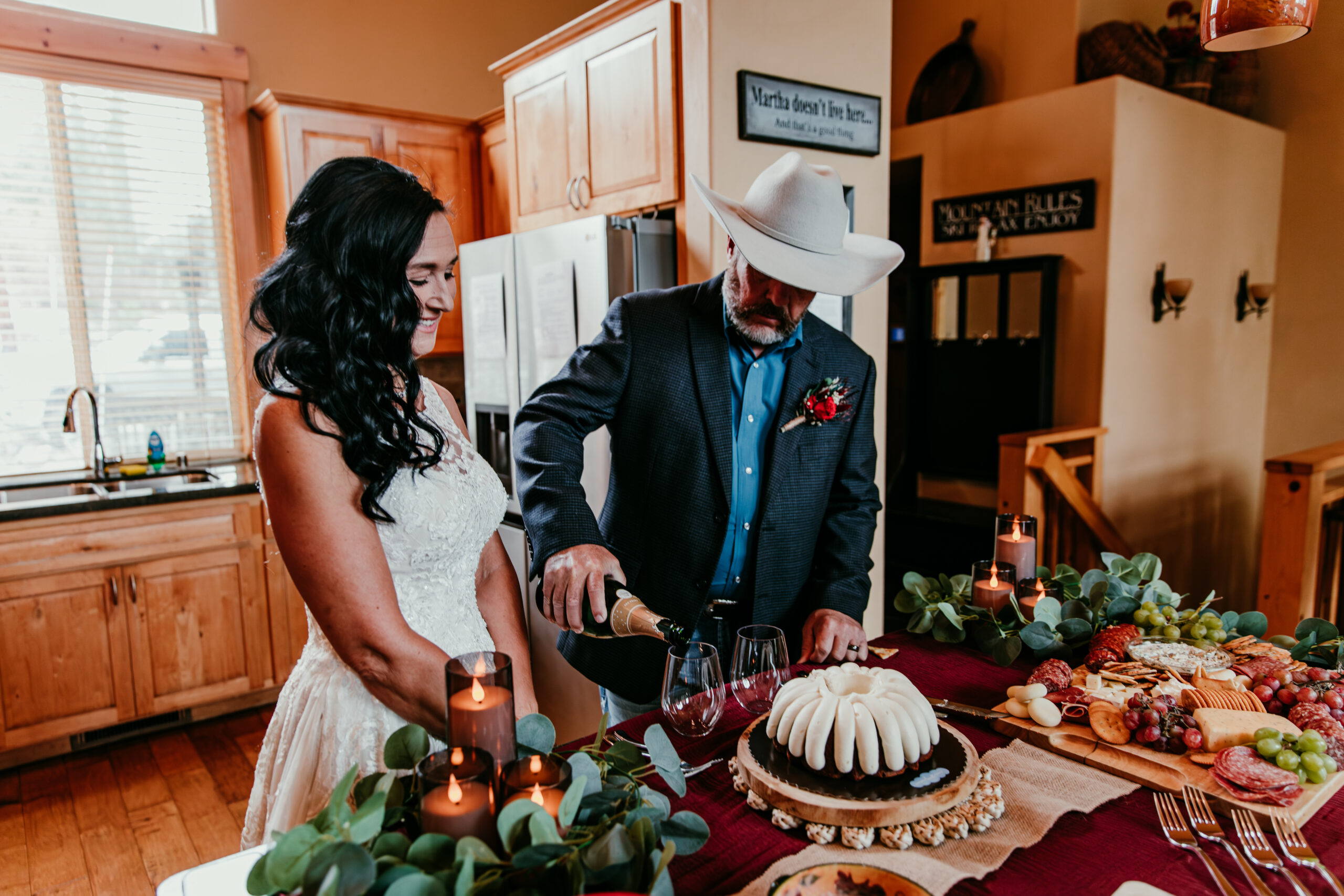 Groom pouring champagne during a private celebration after their Lake Tahoe elopement, creating candid lake tahoe elopement photos with family-style details