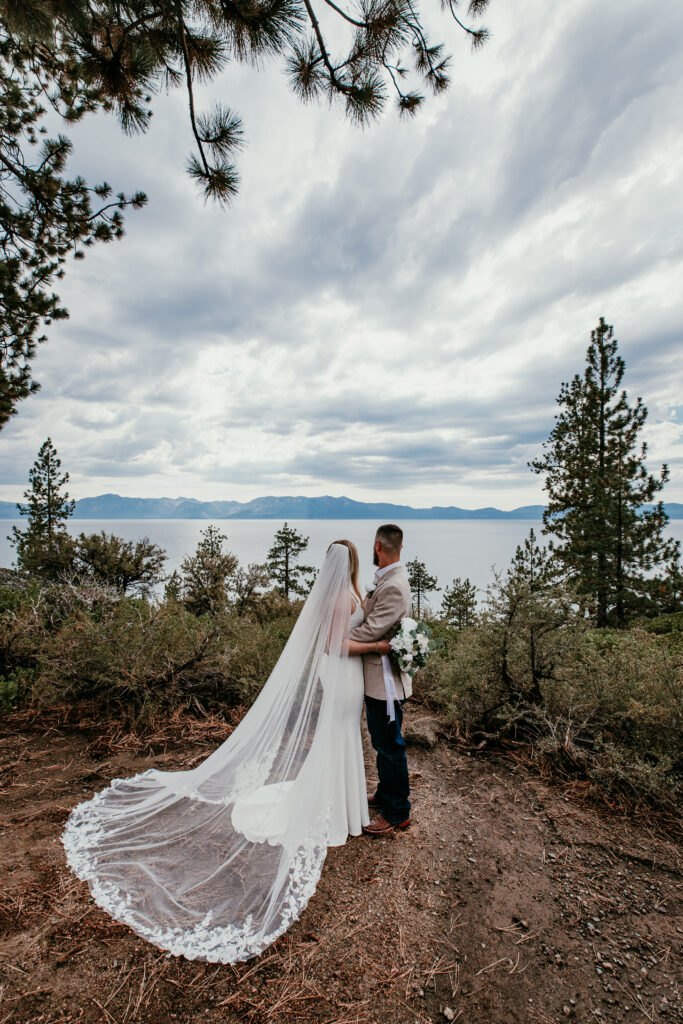 Bride and groom overlooking Lake Tahoe during blended family elopement at Logan Shoals Vista Point