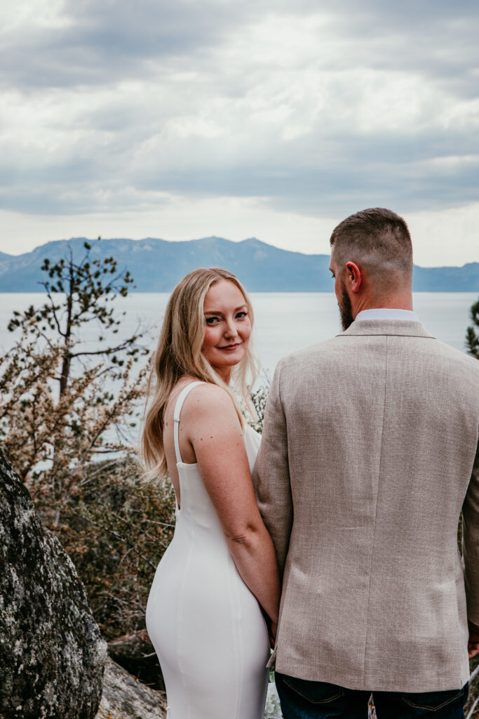 Bride looking over her shoulder during intimate Lake Tahoe elopement portrait at Logan Shoals