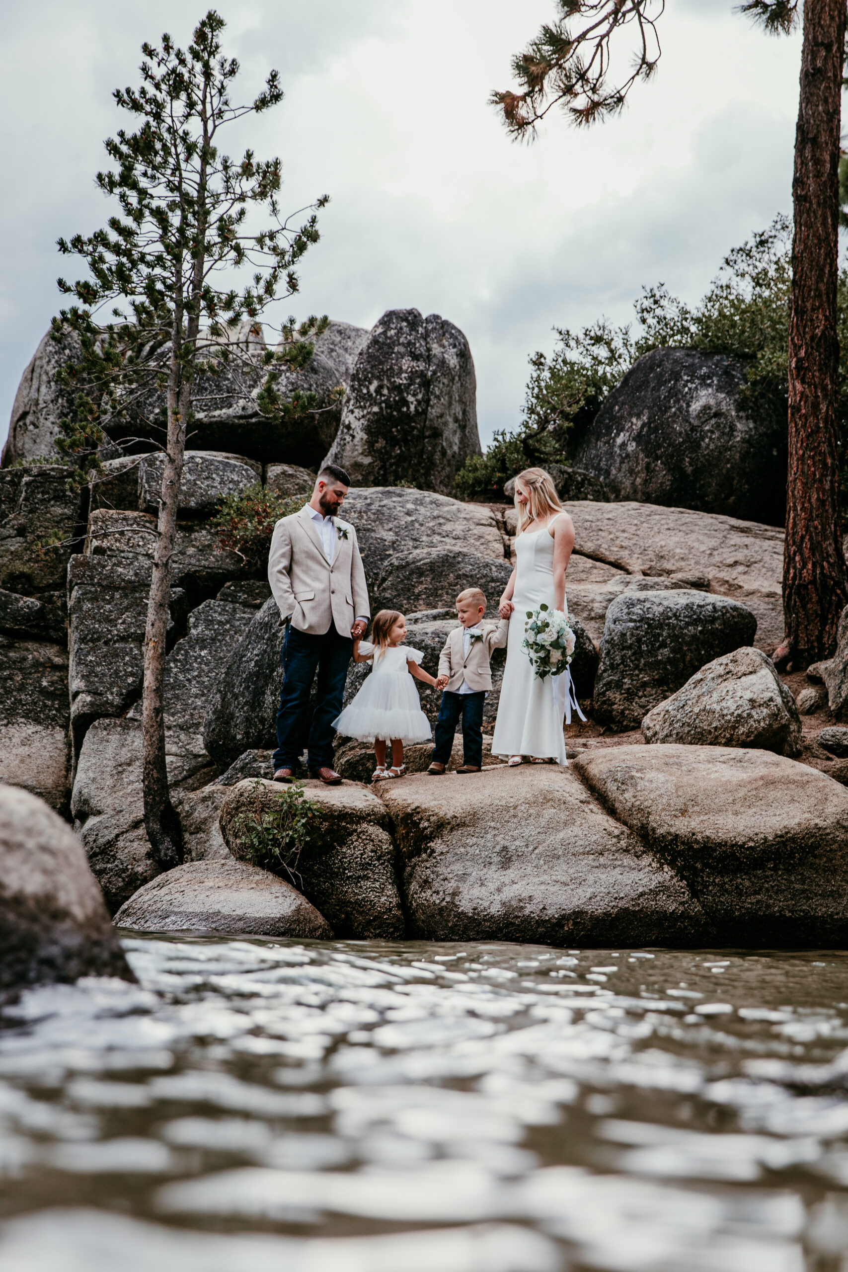 Lake Tahoe blended family elopement portrait on granite rocks at Sand Harbor