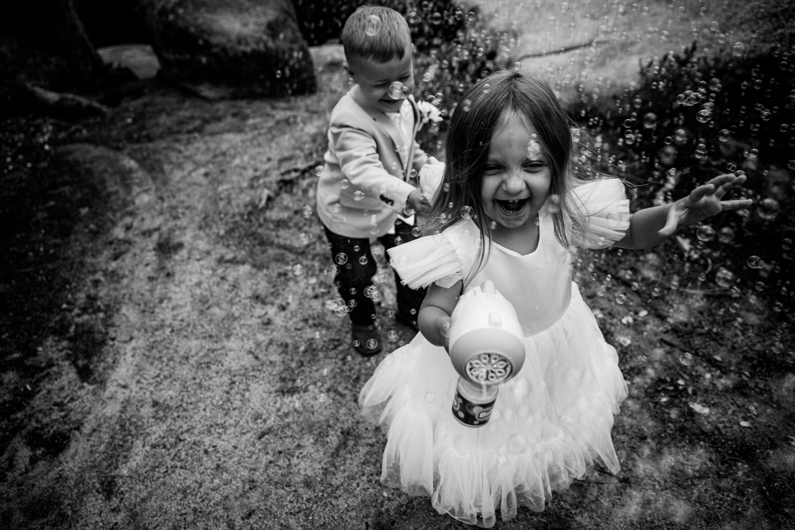 Kids playing during small wedding day, candid and joyful moment showing relaxed family atmosphere