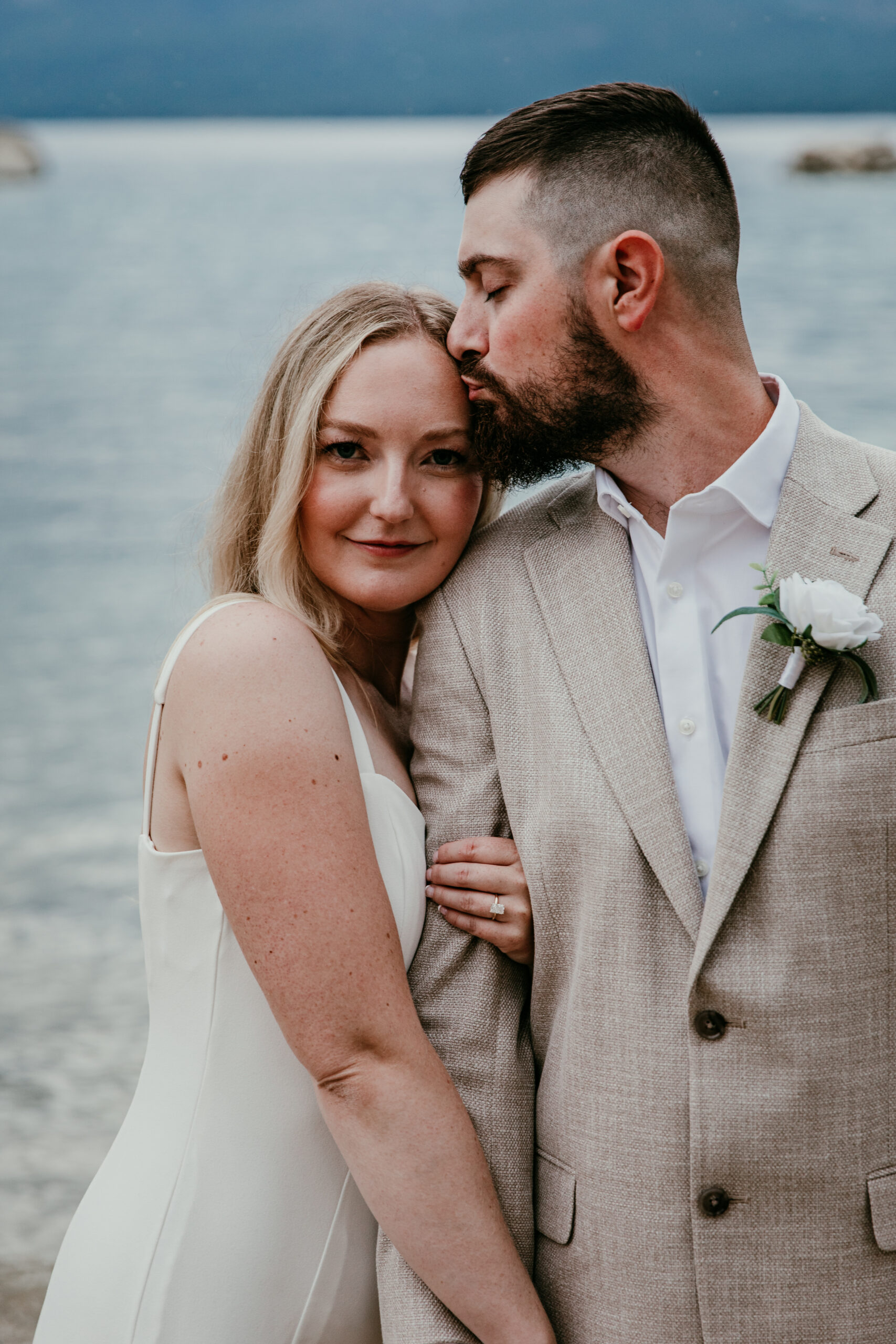 Intimate Lake Tahoe elopement portrait at Sand Harbor with blue lake backdrop