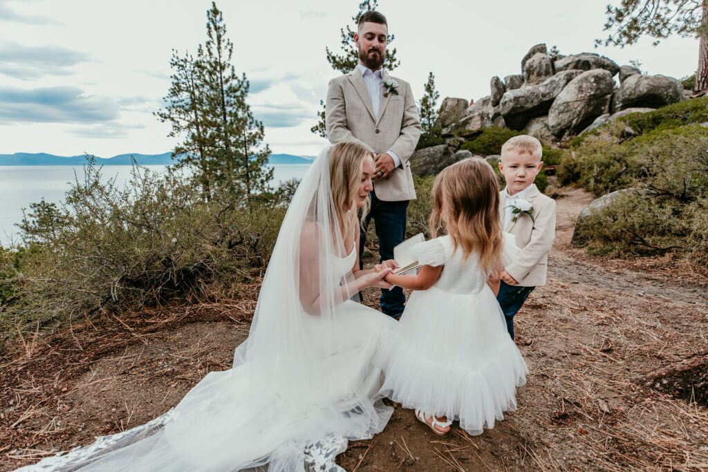 Bride including children in ceremony during blended family elopement at Logan Shoals Vista Point