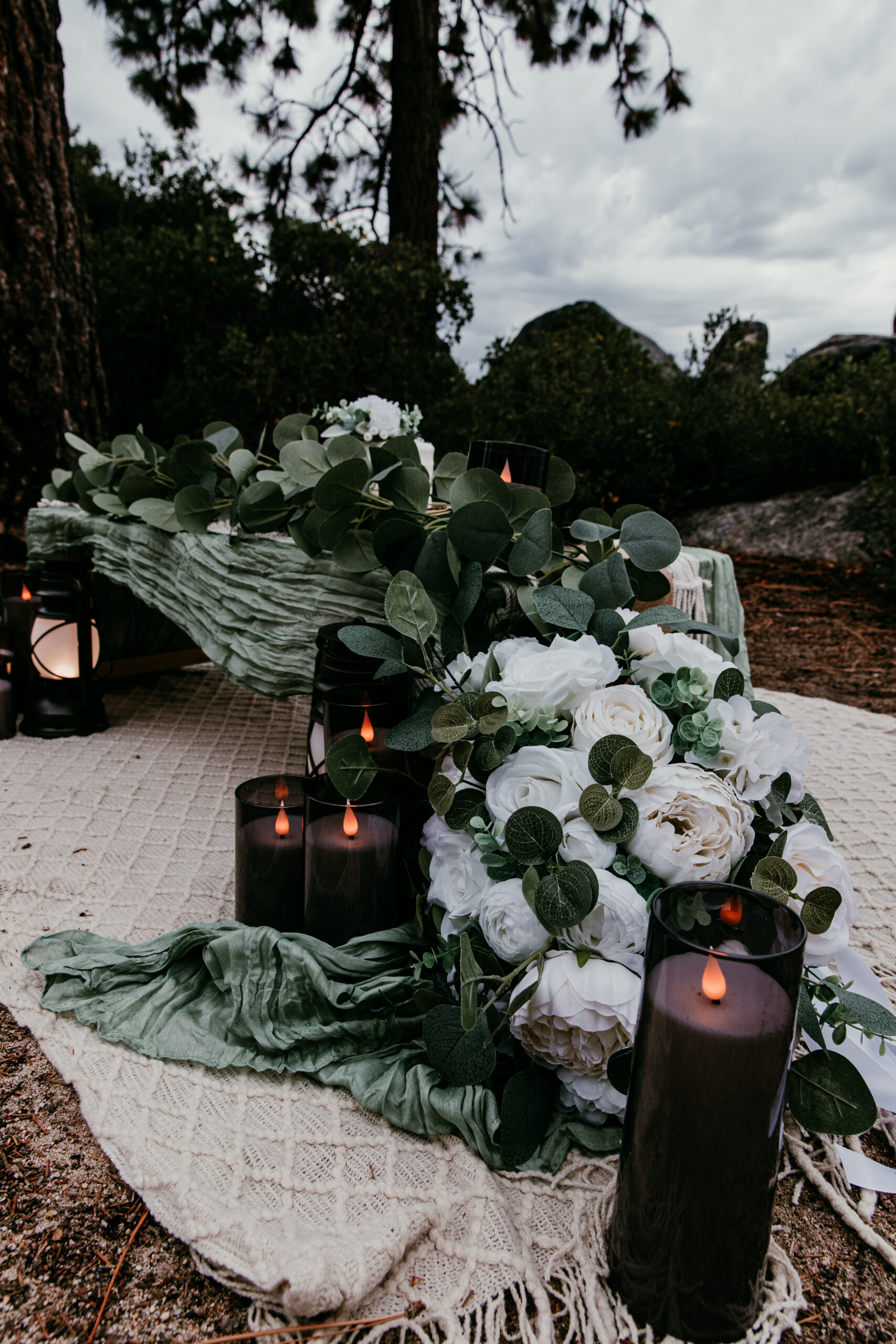 Coordinated faux florals styled into elopement picnic setup at Sand Harbor in Lake Tahoe