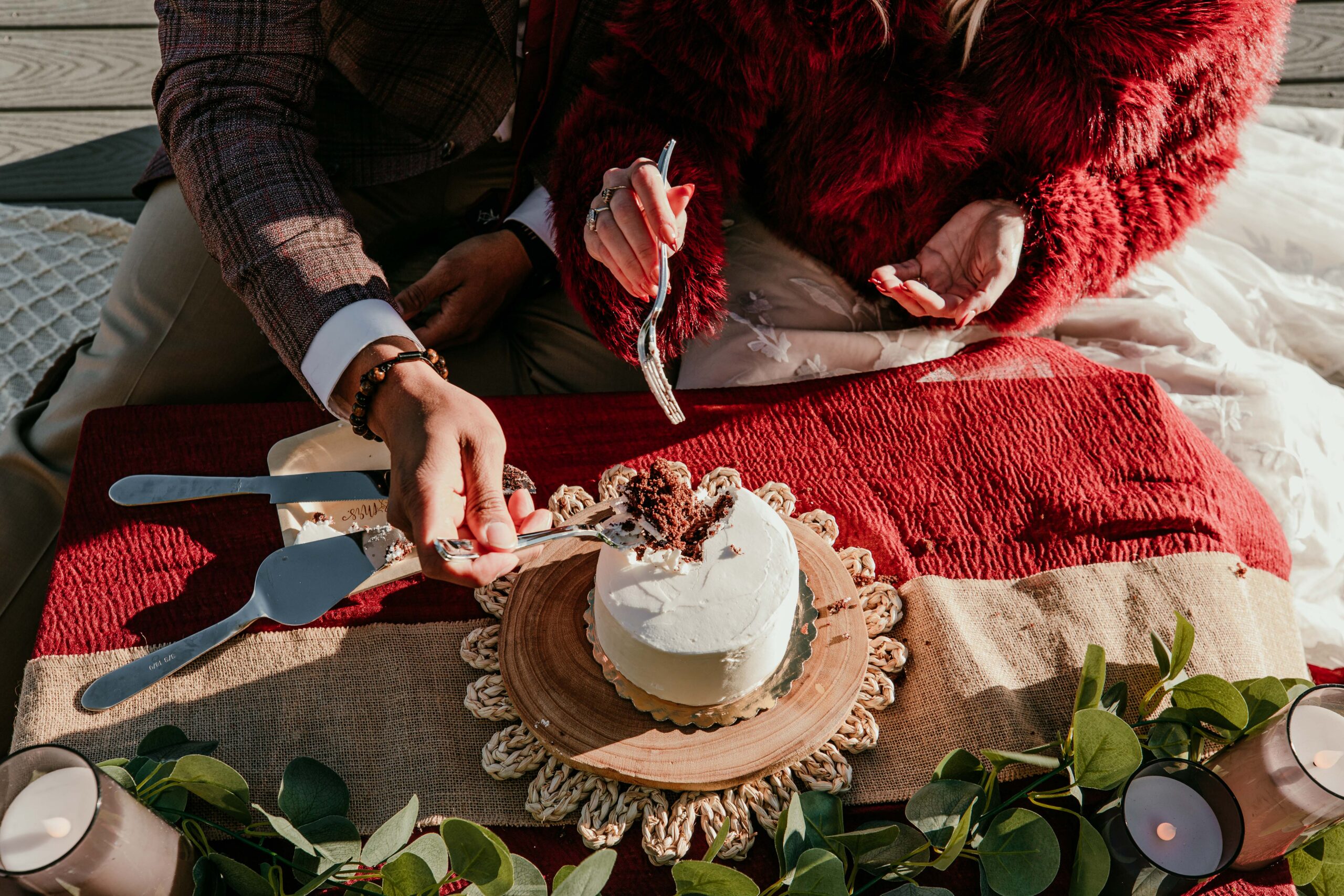 Close-up of small wedding cake during a lakeside winter elopement picnic at Donner Lake.
