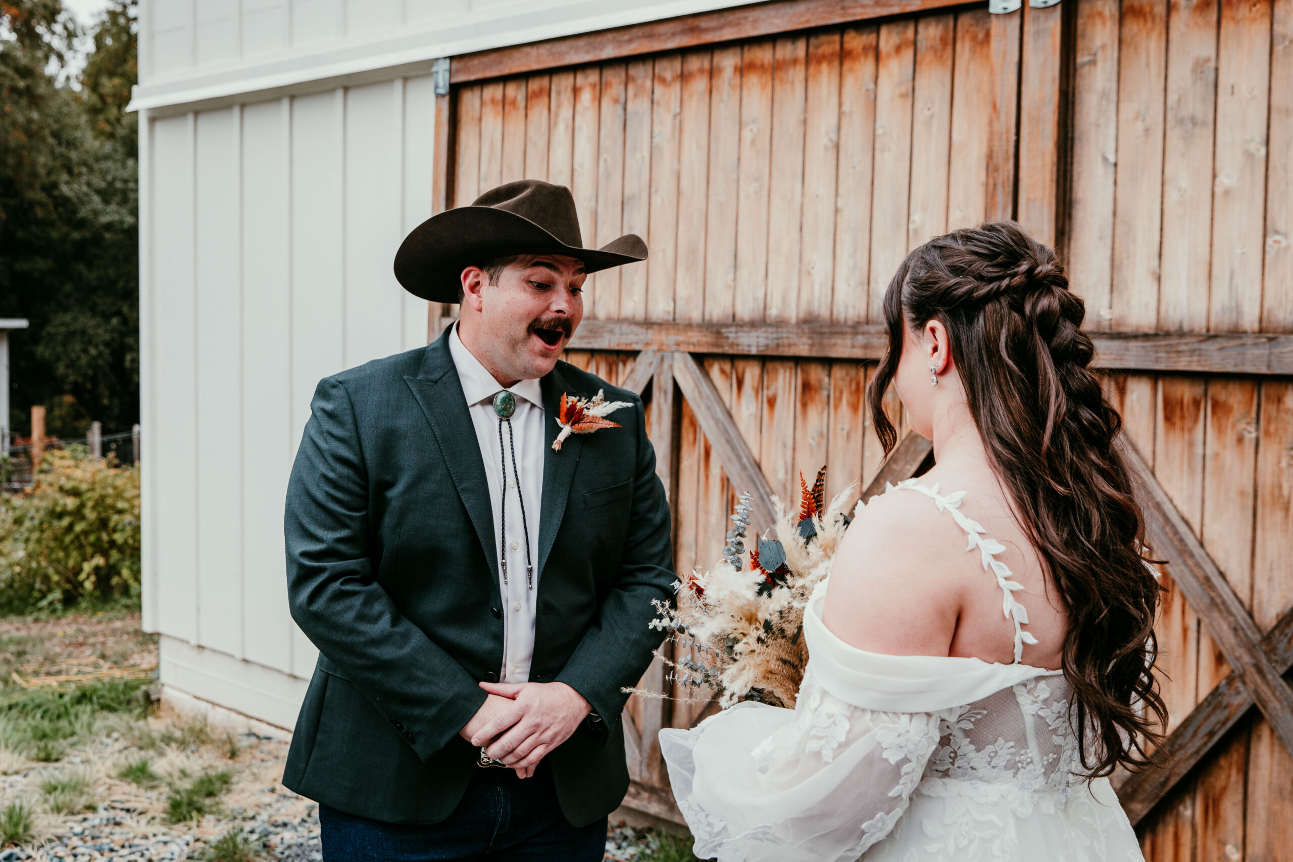 groom reacting during first look before their fall elopement in Yosemite