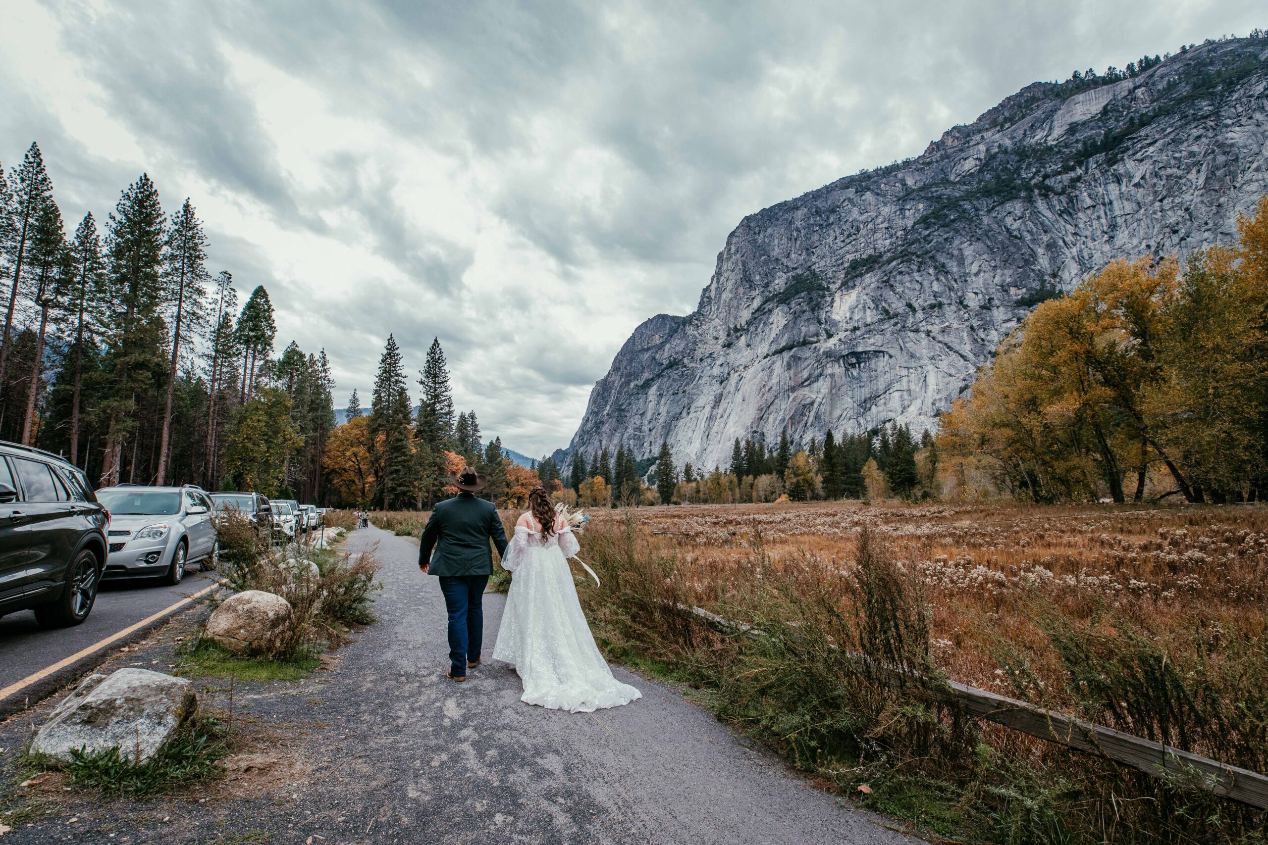 couple walking through Yosemite Valley before their fall elopement ceremony