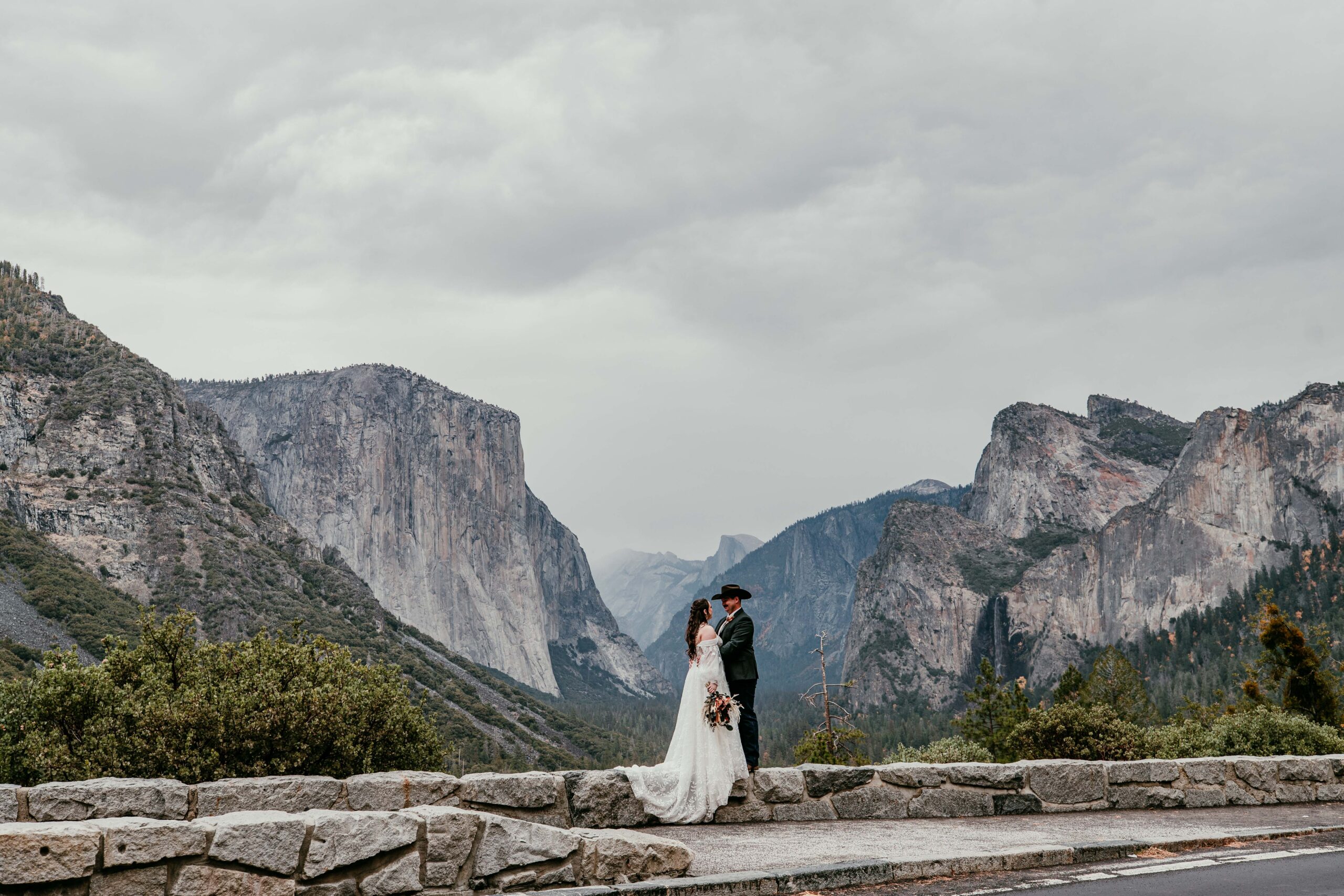 couple at Tunnel View overlooking Yosemite Valley during a fall elopement in Yosemite