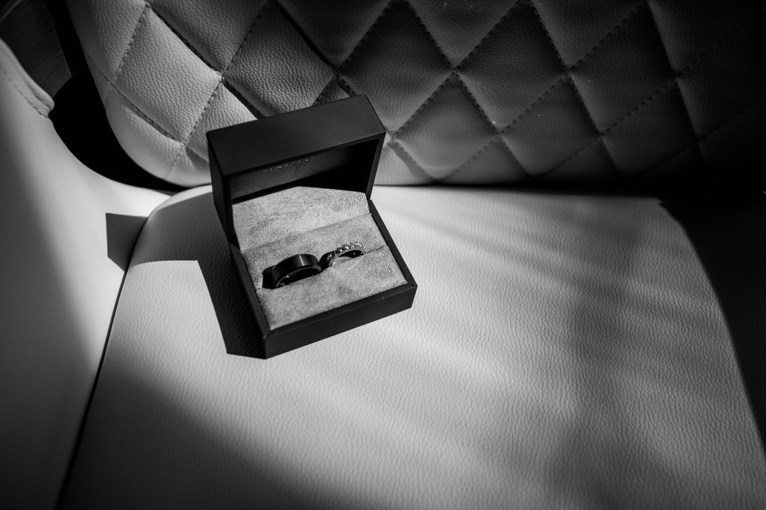 Wedding rings displayed in a black ring box before the couple’s Sand Harbor elopement in Lake Tahoe.