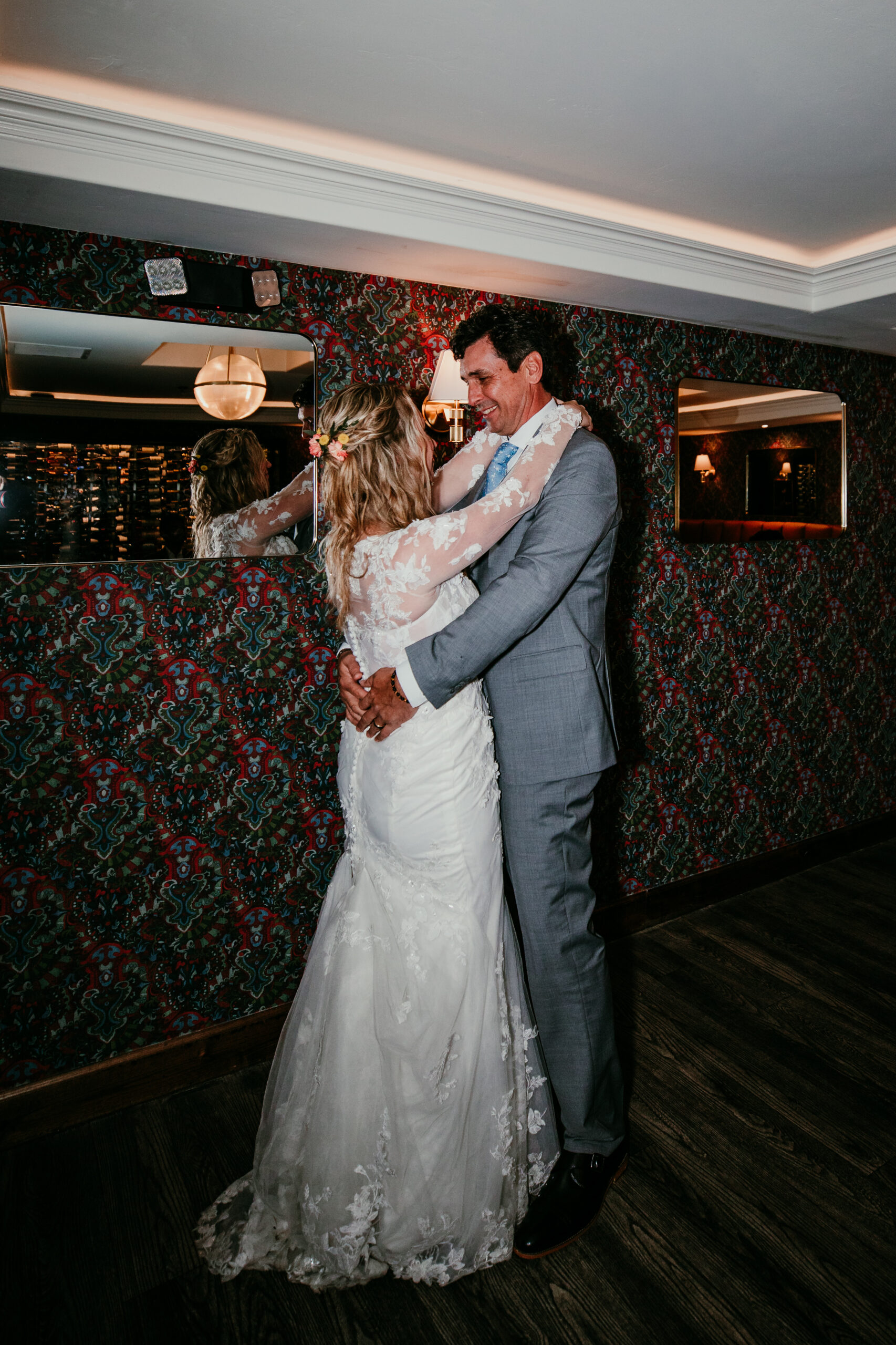 Bride and groom sharing their first dance at The Landing Resort after their rainy Lake Tahoe elopement reception.